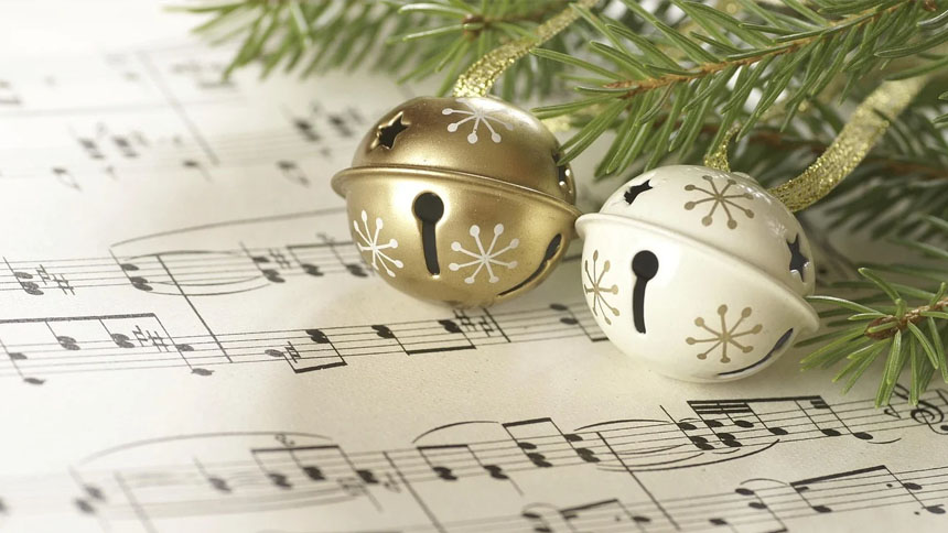 Jingle bell tree ornaments on sheet music