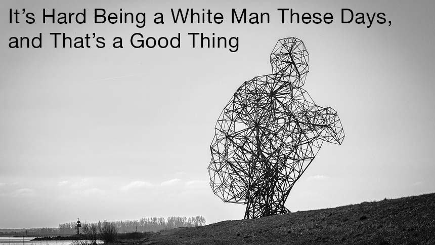 "It's Hard Being a White Man These Days, and That's a Good Thing" black text over black & white photo of wire sculpture in a field of a man squatting 'De hurkende man' ('Exposure')