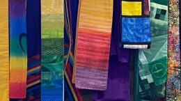 Closeup of colorful minister's stoles hanging on a wall
