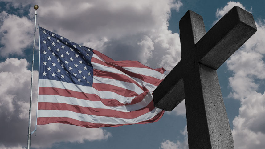 A picture of an American flag next to a cross with blue skies in the background