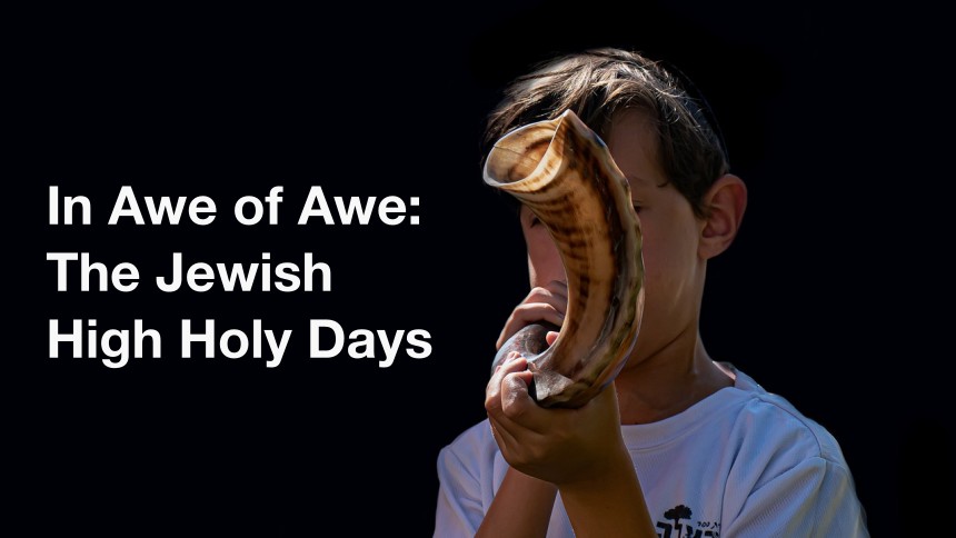 Young child blowing a shofar; light text on dark background: In Awe of Awe: The Jewish High Holy Days