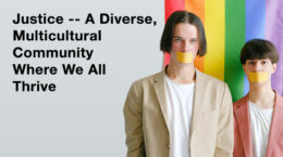 A rainbow colored banner hangs behind two people with their mouths covered.