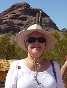 A picture of Lucy Thompson with a mountain in the background.